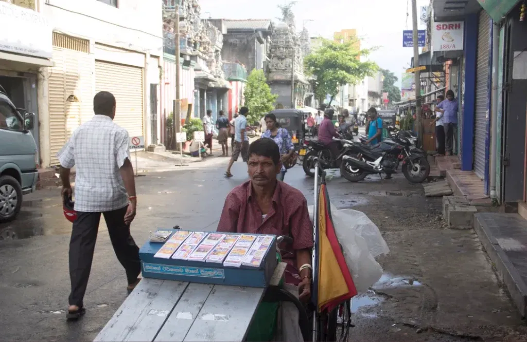A lottery ticket seller in a mobility scooter
