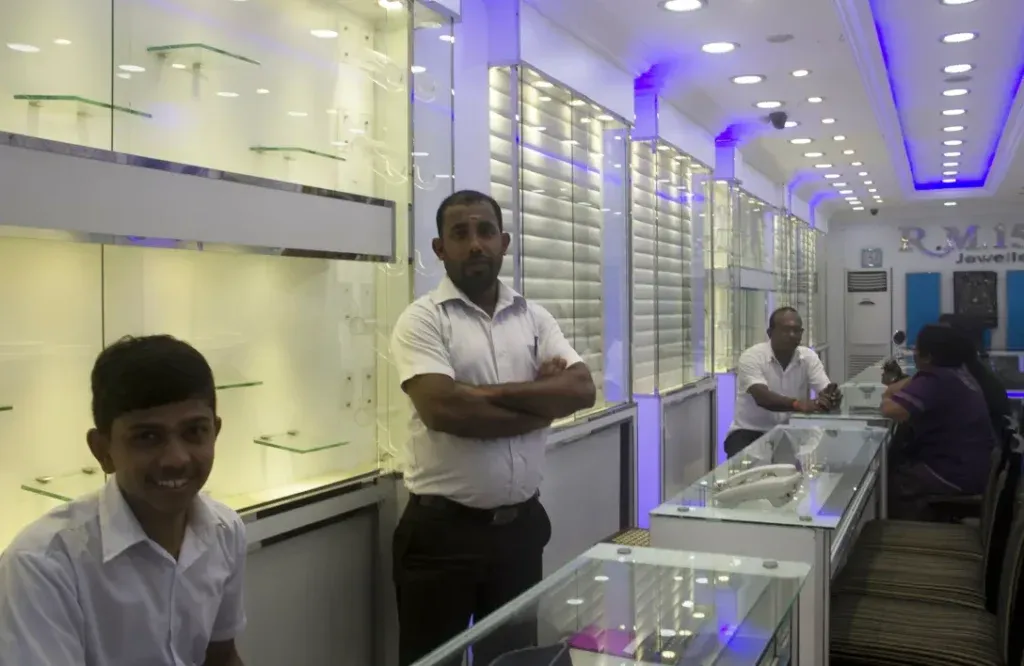 Gold vendors inside a brightly lit shop