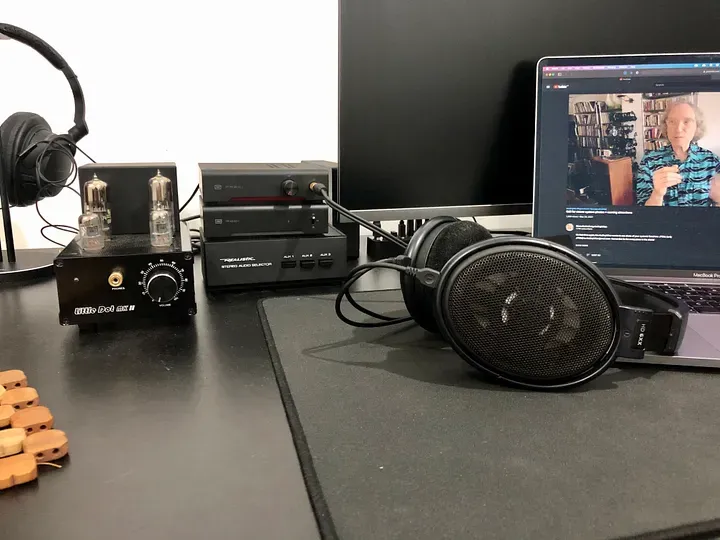 My headphone setup, with tube and solid state amps, a DAC, a switcher, and a pair of open-back headphones