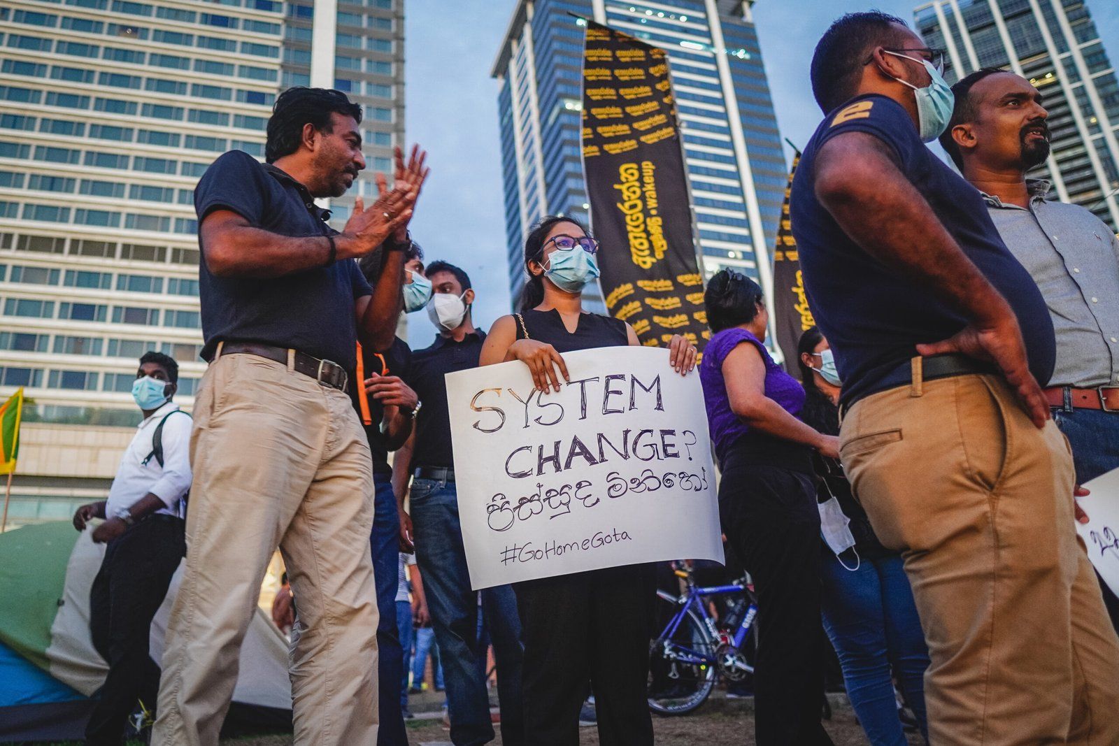 Protestors at the Galle Face Green in Colombo holding placards