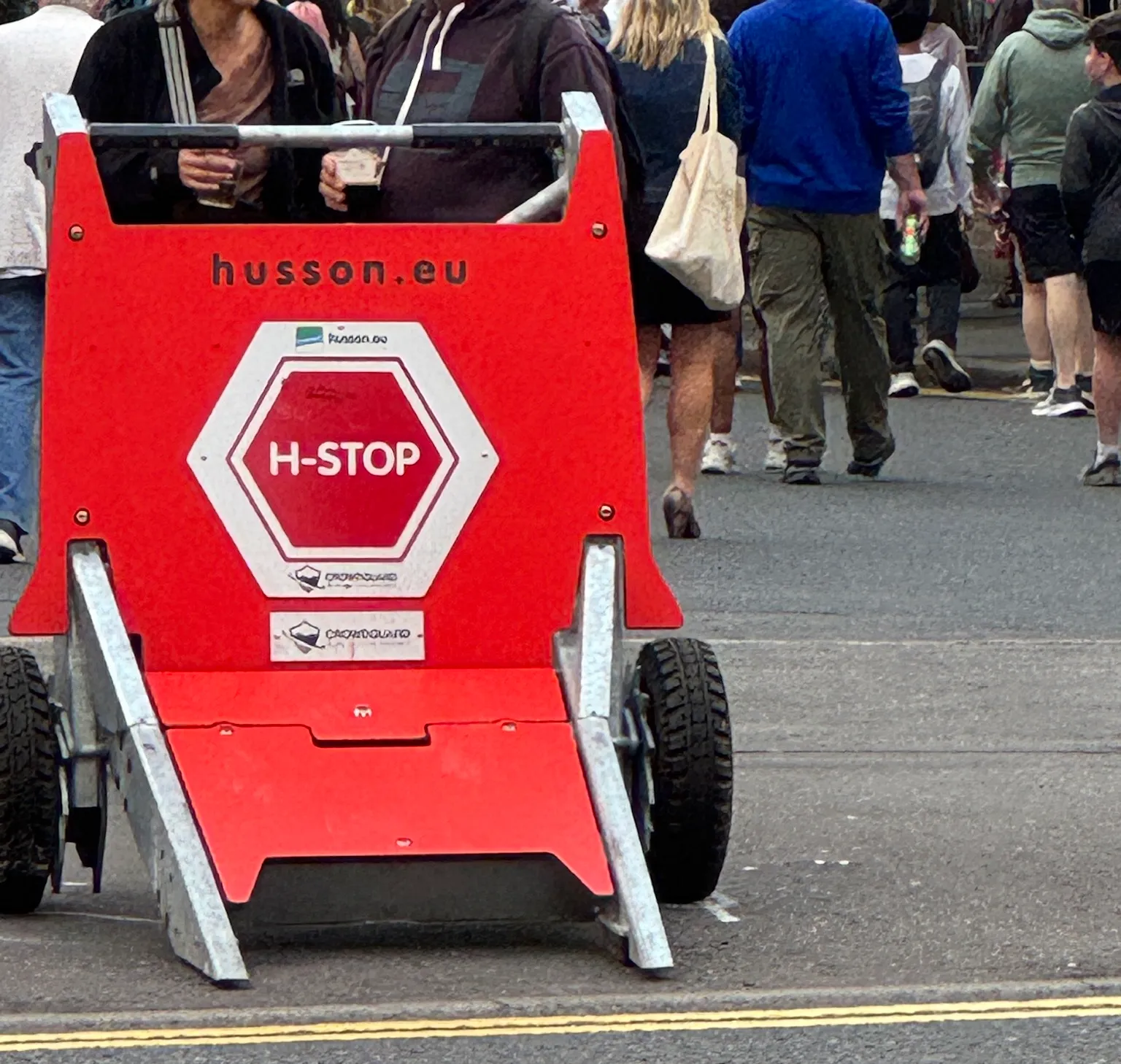 A traffic control sign that reads “H-STOP”