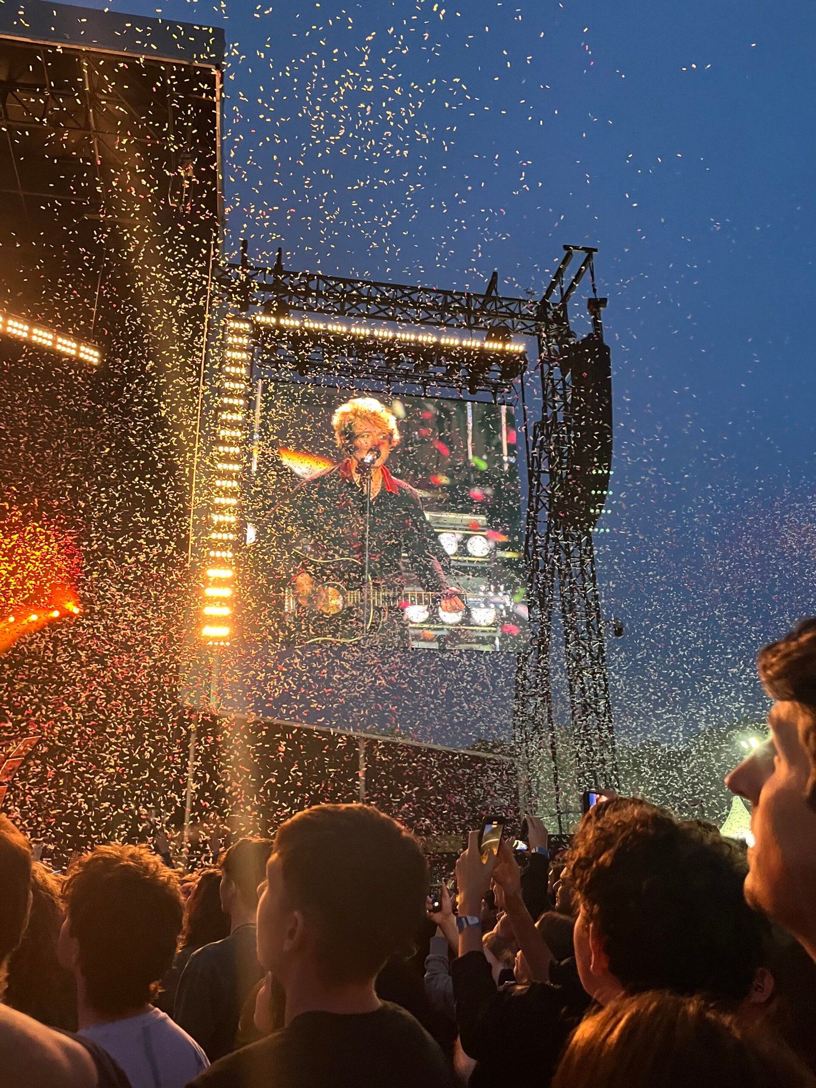 BJ performing on stage at the end of the show, playing Time of Our Lives, while confettie falls all around