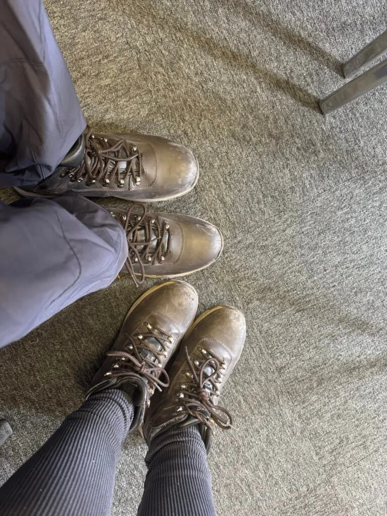 Our boots photographed together. The shoes are a bit worn, and covered in smudges, showing use.