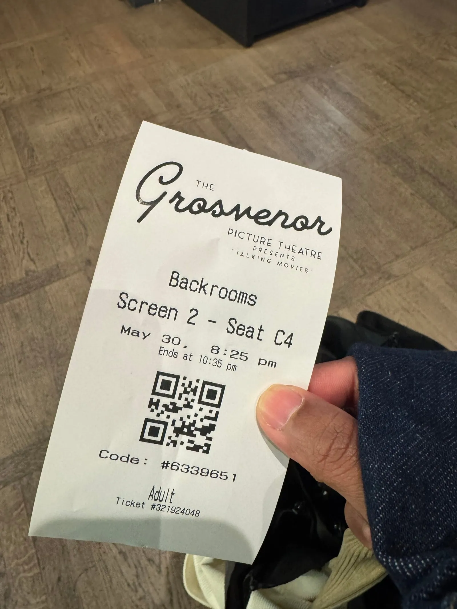 One of our tickets for the film Backrooms, with the screen number and the seat number printed on it.