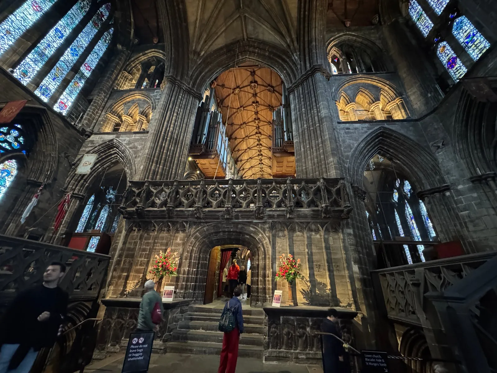 The impressive choir of the cathedral, decorated with an ornate wooden ceiling. There is also a large pipe organ above the entrance.